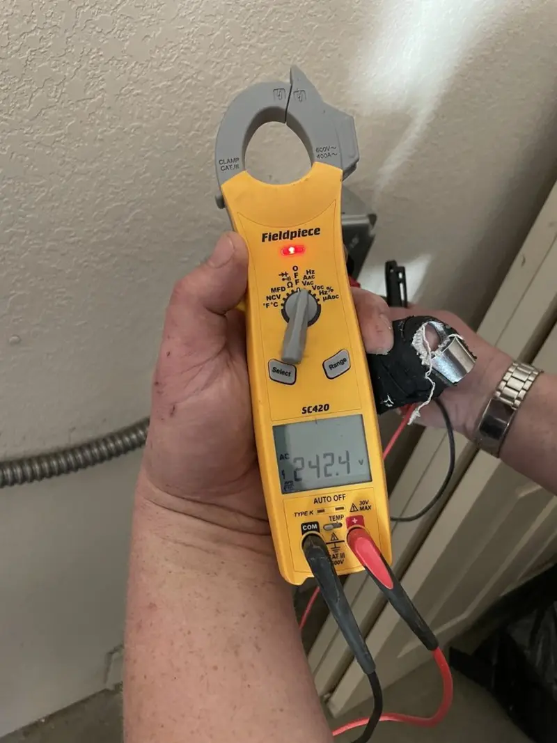Voltage testing with clamp meter during Outlet Installation in Petersburg